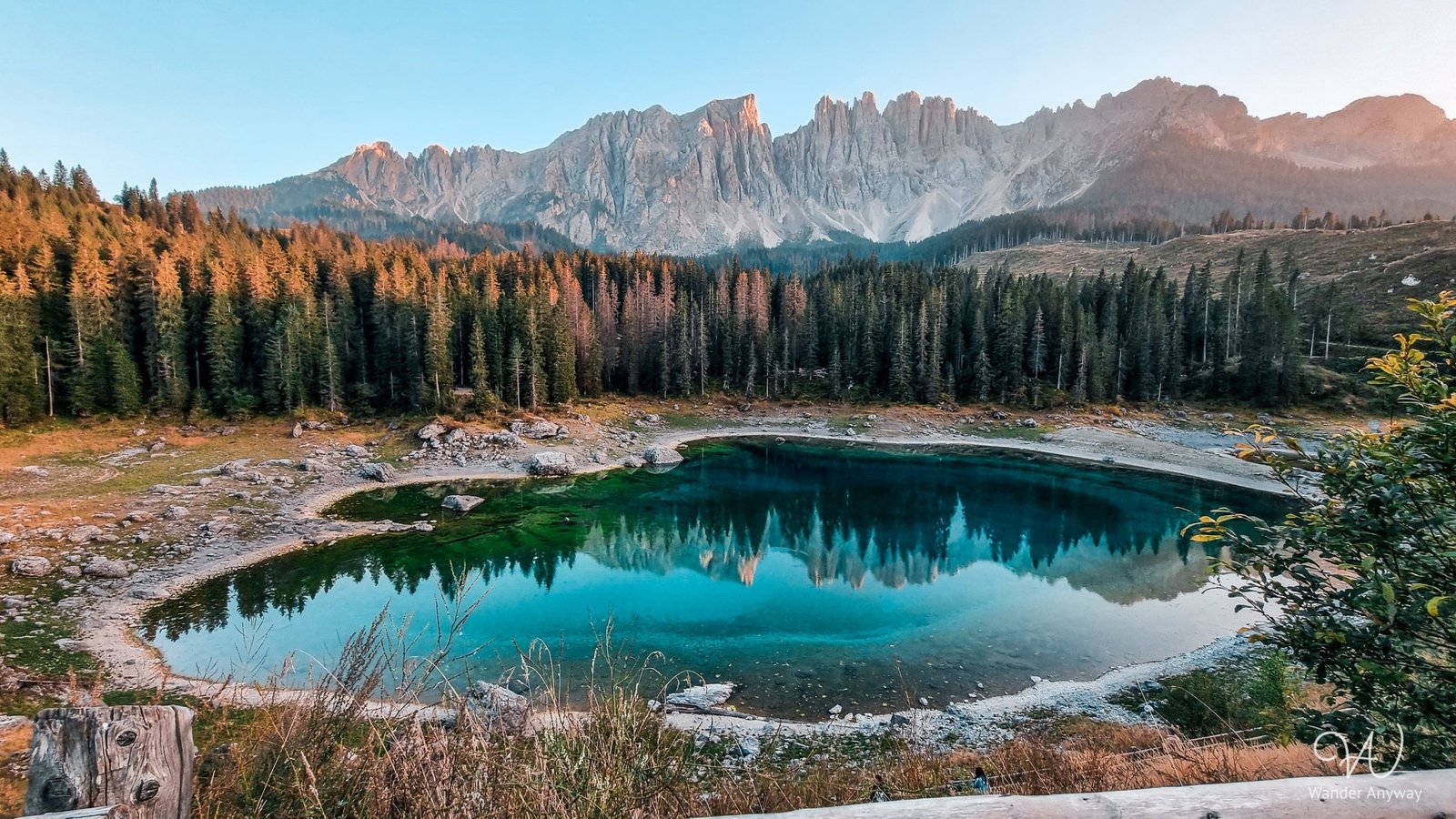 Lake Carezza Bliss: Crystal-clear waters and stunning reflections in the heart of the Dolomites.