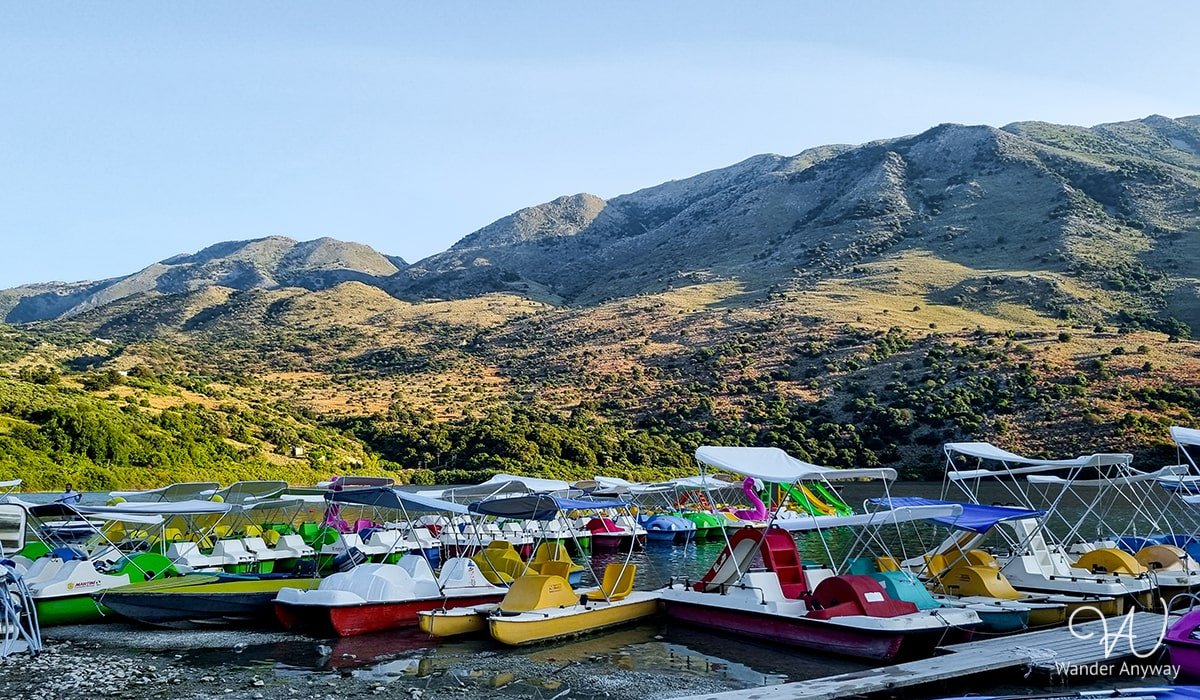 Scenic Lake Kournas Beach offering a freshwater oasis with clear waters and beautiful nature.