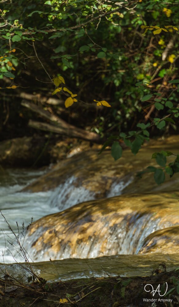 Small cascades of the Elsa River flowing through Colle di Val d’Elsa on the Elsa Trail Tuscany.