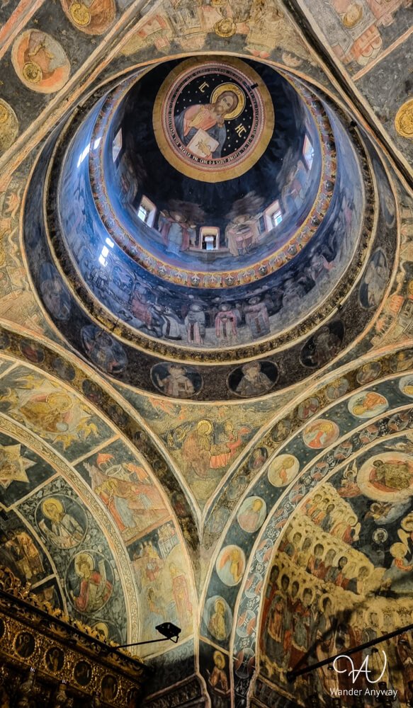 Colorful frescoes on the dome of Stavropoleos Church, a cultural highlight in Bucharest.