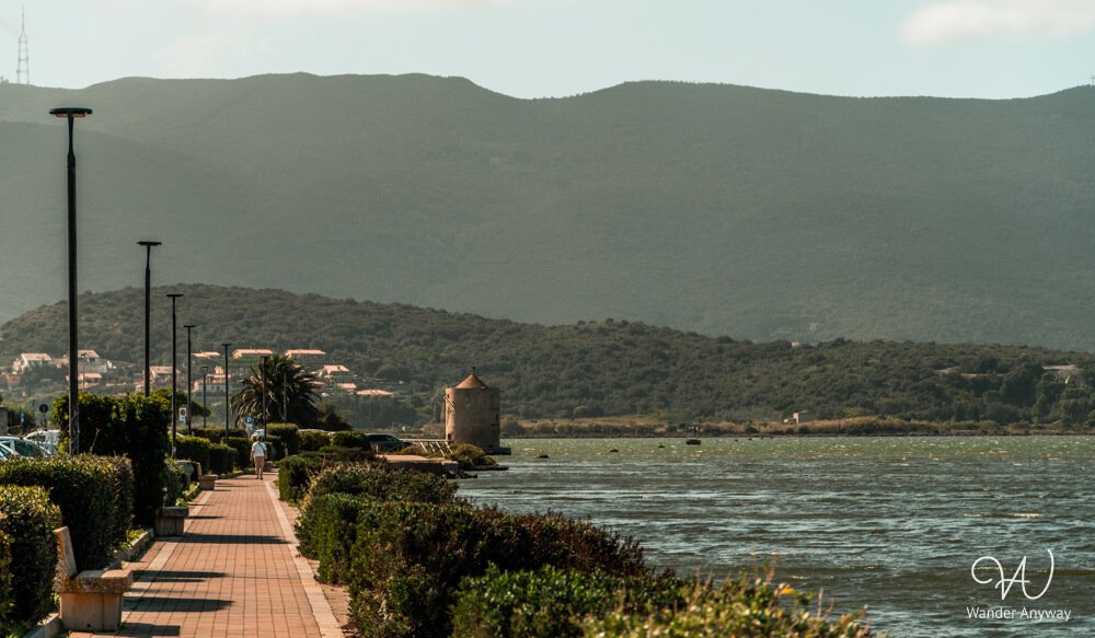 Peaceful waterfront path in Orbetello on the Tuscany road trip itinerary