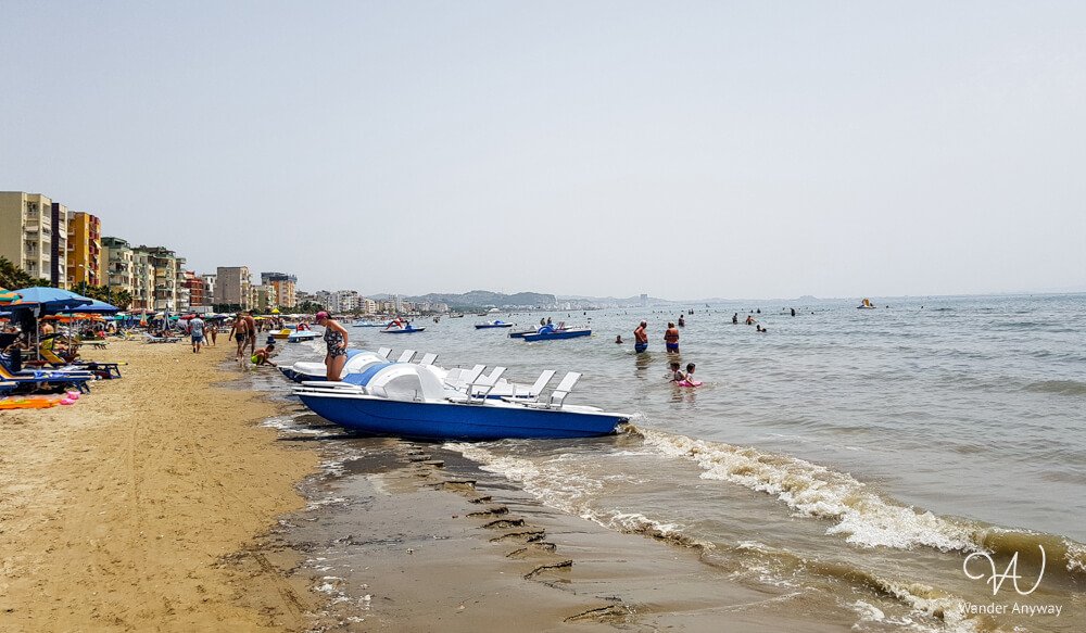People enjoying the sandy beach in Durrës, Albania