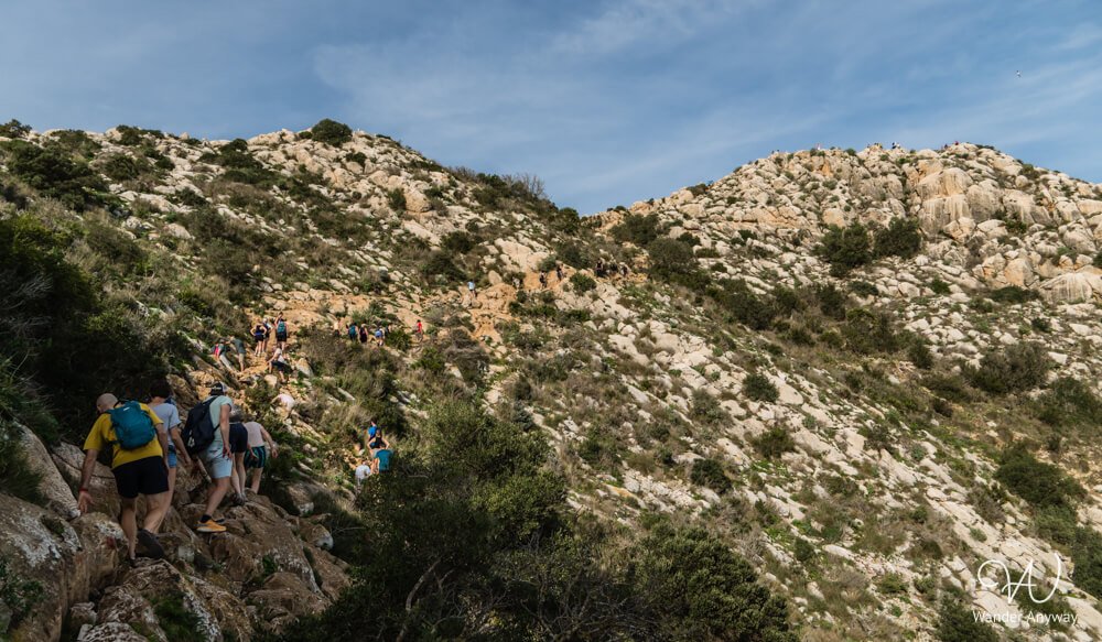 Hikers starting the Peñón de Ifach hiking trail in Calpe