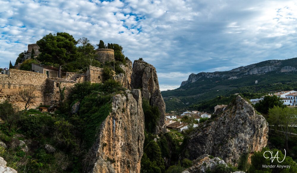 Panoramic view from Guadalest Castle overlooking cliffs and valley.