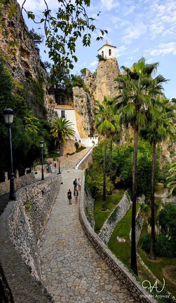 Stone pathway leading to Guadalest’s famous bell tower viewpoint.