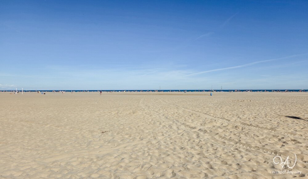 Playa de la Malvarrosa with golden sand and calm Mediterranean water.