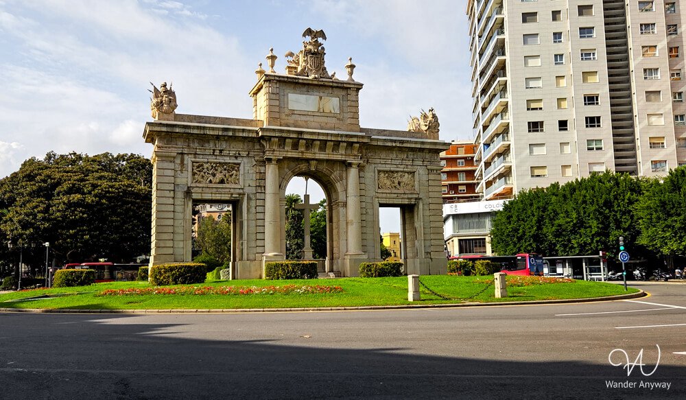 Neoclassical Puerta del Mar archway marking the entrance to central Valencia.