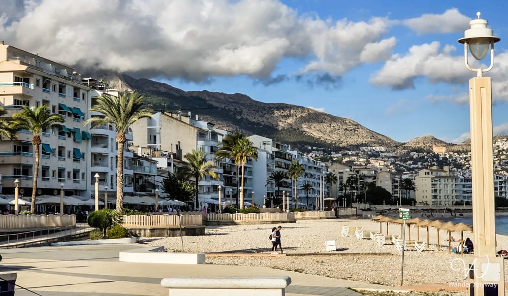 Pebble beach and seafront promenade in Altea, Spain